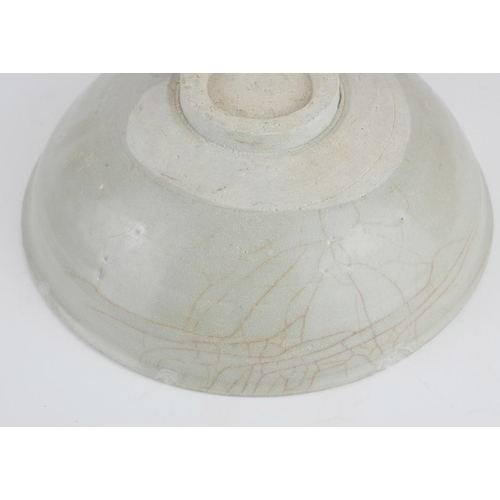 280 - A CHINESE CELEDON GLAZED POTTERY SHALLOW BOWL
With unglazed footrim.
(approx 18cm x 7cm)