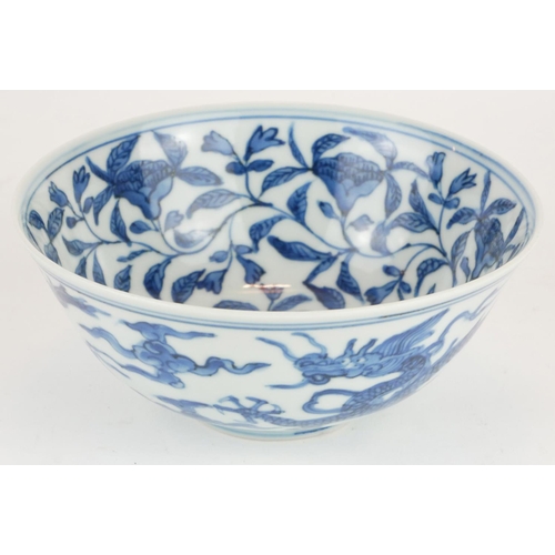 286 - A CHINESE BLUE AND WHITE PORCELAIN 'FIVE TOE DRAGON' BOWL
Hand painted with dragons amongst stylized... 