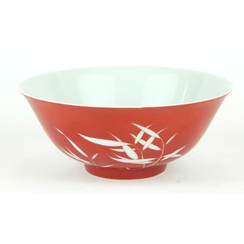 291 - A CHINESE CORAL GROUND RESERVE DECORATED 'BAMBOO' BOWL
Having a white bamboo design to body and a si... 