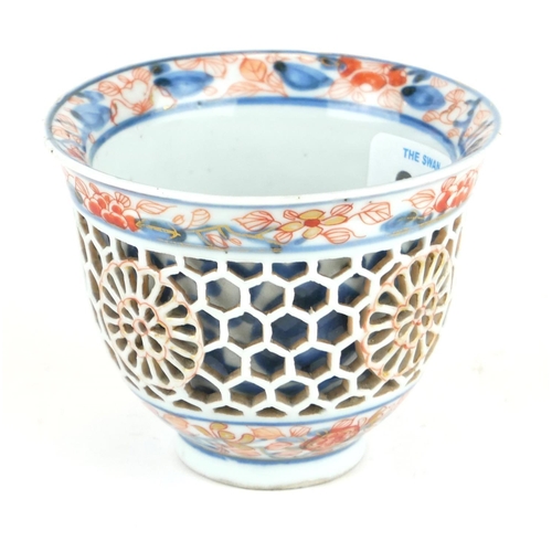 294 - A CHINESE IMARI PORCELAIN RETICULATED DOUBLE WALLED CUP
Having pierced honeycomb frame with undergla... 