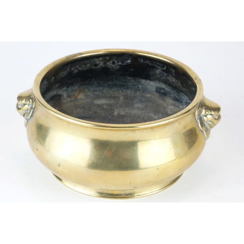 297 - A CHINESE BRONZE CENSER
Having twin lion mask handles, bearing a six character Ming Dynasty 1426 - 1... 