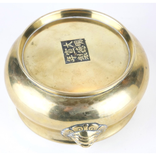 297 - A CHINESE BRONZE CENSER
Having twin lion mask handles, bearing a six character Ming Dynasty 1426 - 1... 