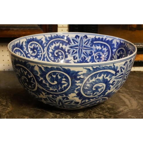 245a - A LARGE ORIENTAL BLUE AND WHITE PORCELAIN BOWL
Having an underglaze blue decoration of scrolled and ... 
