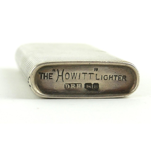 241 - A VINTAGE HALLMARKED SILVER, THE HOWITT LIGHTER, PETROL.
(6cm)