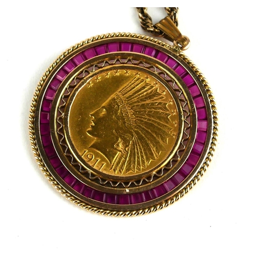 254 - AN AMERICAN 21CT GOLD TEN DOLLAR INDIAN HEAD/EAGLE COIN AND RUBY MEDALLION NECKLACE, DATED 1911
Edge... 