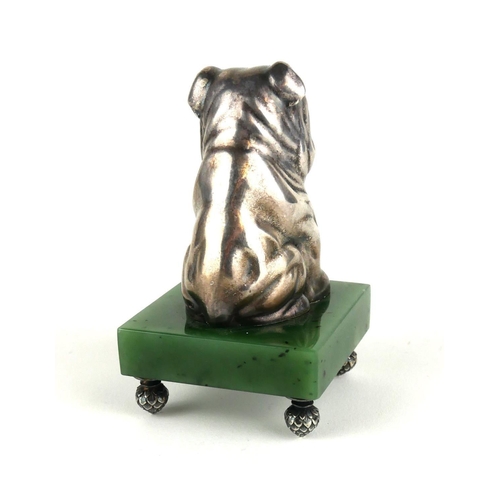 265 - A RUSSIAN SILVER AND NEPHRITE JADE BULLDOG PAPERWEIGHT
Seated pose with garnet eyes, bearing ‘Kokovs... 