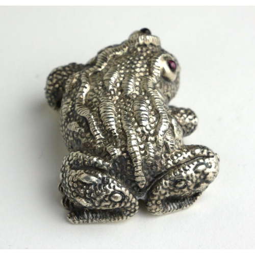 267 - A 20TH CENTURY RUSSIAN SILVER AND GARNET MODEL OF A TOAD
With garnet set eyes, bearing ‘Kokovshnik 8... 