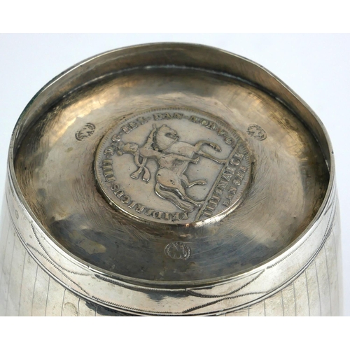 281 - A LARGE CONTINENTAL WHITE METAL COMMEMORATIVE BEAKER
Having fine engraved decoration and set with fo... 