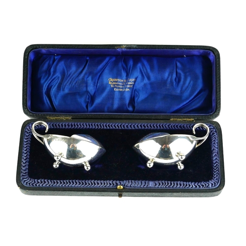 287 - A CASED PAIR OF EARLY 20TH CENTURY SCOTTISH OVAL SILVER SALTS
With gilt interior, hallmarked Crichto... 