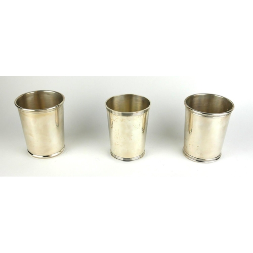 292 - A COLLECTION OF THREE STERLING SILVER BEAKERS
Each having a different design to rim, one marked 'Mar... 