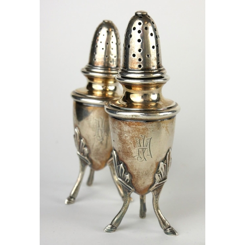 301 - WITHDRAWN AN UNUSUAL PAIR OF EARLY 20TH CENTURY CONTINENTAL WHITE METAL PEPPERETTES
Having dome form... 