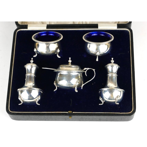 305A - AN EARLY 20TH CENTURY SILVER FIVE PIECE CONDIMENT SET
Comprising two circular salts and a mustard po... 