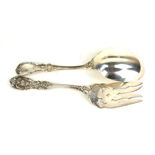 323 - WITHDRAWN REED AND BARTON, A PAIR OF EARLY 20TH CENTURY STERLING SILVER SALAD SERVERS
Having embosse... 