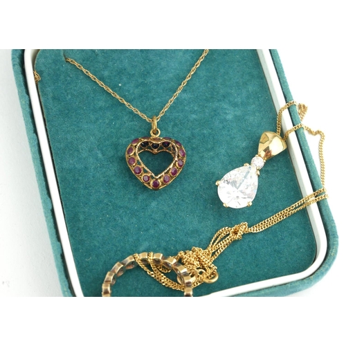 337 - A VINTAGE 9CT GOLD, SAPPHIRE AND RUBY PENDANT NECKLACE
Heart form with opposing round cut stones on ... 