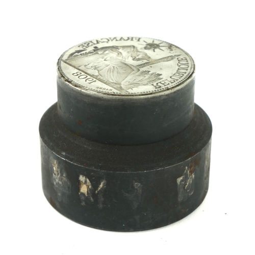 346 - A CONTINENTAL WHITE METAL DESK SEAL
Having an intaglio cast figural coin featuring a seated figure o... 