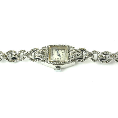 375 - A VINTAGE WHITE METAL AND MARCASITE LADIES’ COCKTAIL WATCH
With square tone dial and pierced bracele... 