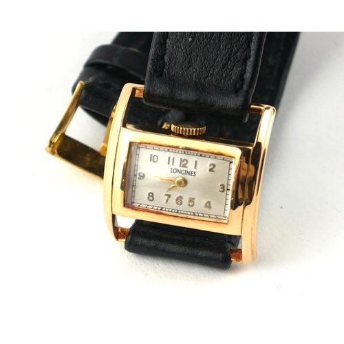 387 - LONGINES, A VINTAGE 14CT GOLD LADIES’ WRISTWATCH
Rectangular dial with Arabic number markings and cu... 