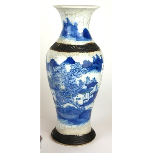 408A - A LATE 19TH CENTURY CHINESE PORCELAIN BLUE AND WHITE BALUSTER VASE 
Decorated with continuous mounta... 