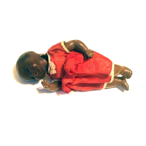 411A - ARMAND MARSEILLE, AN EARLY 20TH CENTURY GERMAN BISQUE MULATTO BLACK CHARACTER BABY DOLL, CIRCA 1930
... 