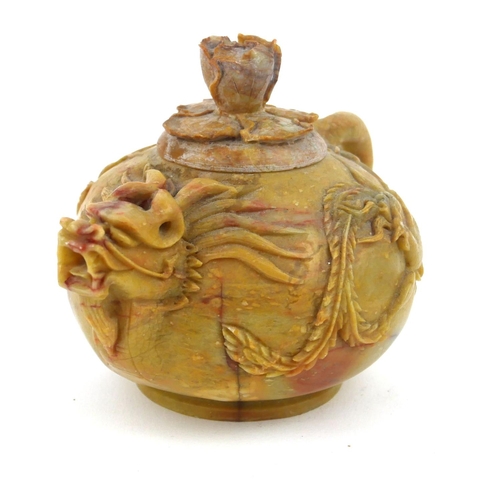 413 - AN EARLY QING DYNASTY CHINESE SOAPSTONE DRAGON TEAPOT AND COVER
The ovoid body with delicate spout a... 