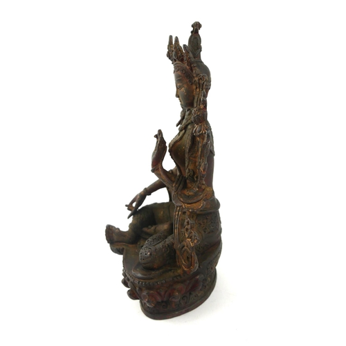 415 - A TIBETAN BRONZE LAKSHMI BUDDHA FIGURE
Seated pose flanked by two lotus flowers.
(approx 23cm)