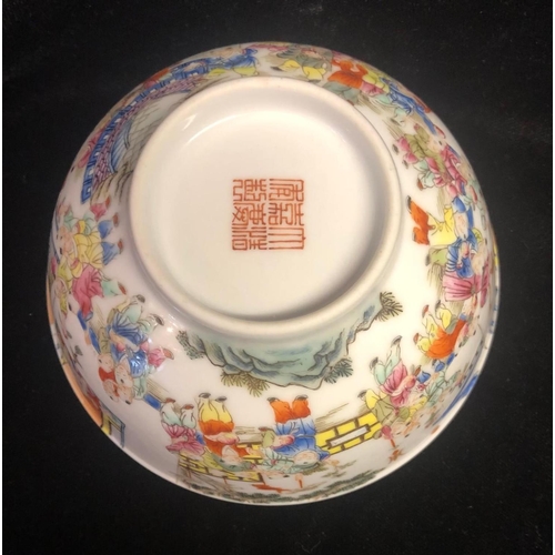 425A - A CHINESE FAMILLE ROSE THOUSAND BOYS DECORATED BOWL, bearing a Qing dynasty mark. Diameter 11.4 x H ... 