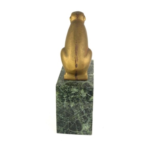 426 - AN ART DECO BRONZE SCULPTURE OF A POLAR BEAR
having square form features, on a green marble plinth.
... 