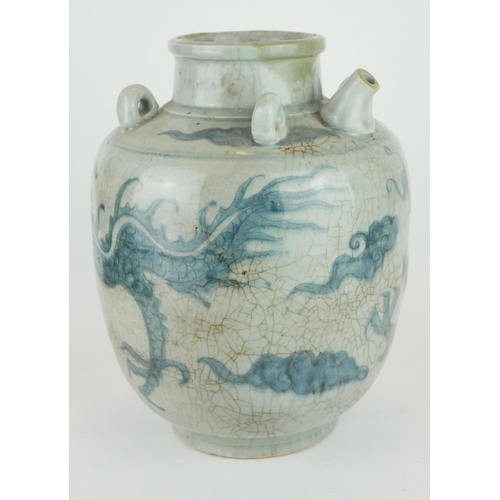 428A - A CHINESE PROVINCIAL MING PERIOD RICE WINE JUG
Decorated with a four toe dragon on a pale blue groun... 