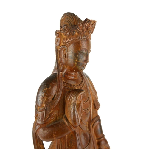 431 - AN ANTIQUE CHINESE CARVED STONE STATUE OF GUANYIN
Standing pose with one arm raised and long flowing... 