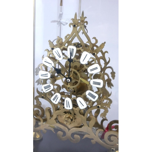 435A - A LARGE PIERCED BRASS SKELETON CLOCK
With fusée movement in glass and brass bound display case.
(54c... 