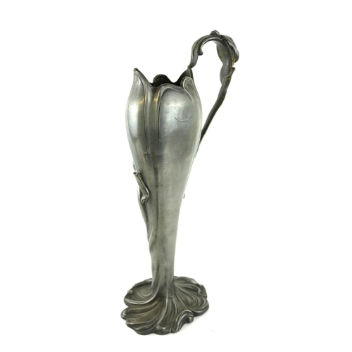 440 - AN ART NOUVEAU CONTINENTAL PEWTER TWIN HANDLED VASE
Organic form with mask handles and embossed figu... 