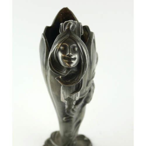 440 - AN ART NOUVEAU CONTINENTAL PEWTER TWIN HANDLED VASE
Organic form with mask handles and embossed figu... 