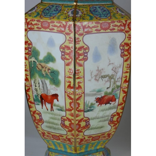 444A - A PAIR OF CHINESE FACETED BALUSTER VASES
Panels decorated with animals in landscapes amongst floral ... 