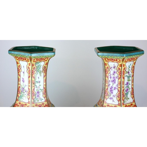 444A - A PAIR OF CHINESE FACETED BALUSTER VASES
Panels decorated with animals in landscapes amongst floral ... 