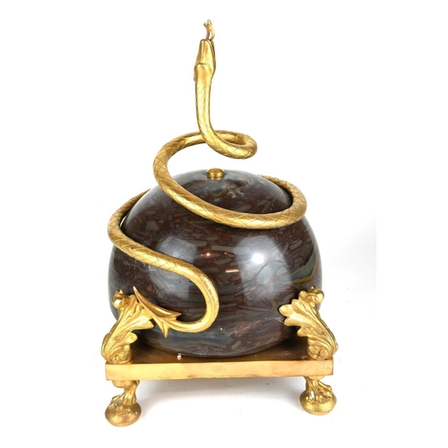 452A - A GILT BRONZE AND MARBLE CENTREPIECE, SERPENTINE ENTWINED BALL.
(35cm)

Condition: good