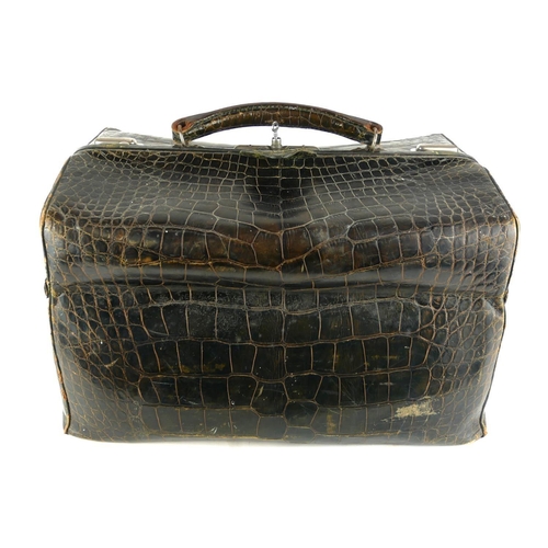 460 - A LATE 19TH CENTURY DOCTORS FAUX CROCODILE SKIN GLADSTONE BAG
With contents including silver topped ... 