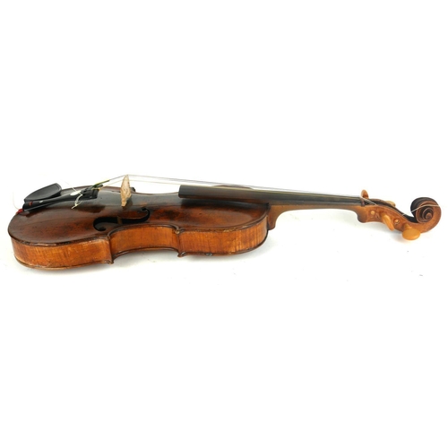 467 - A LATE 18TH CENTURY VIOLIN
With mother of pearl inlaid tailpiece the bow, stamped 'Germany', wooden ... 