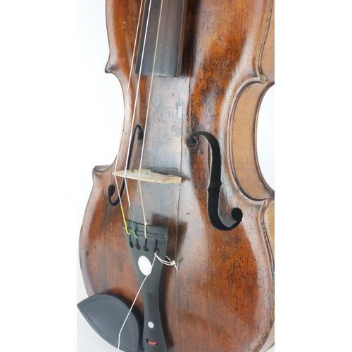 467 - A LATE 18TH CENTURY VIOLIN
With mother of pearl inlaid tailpiece the bow, stamped 'Germany', wooden ... 