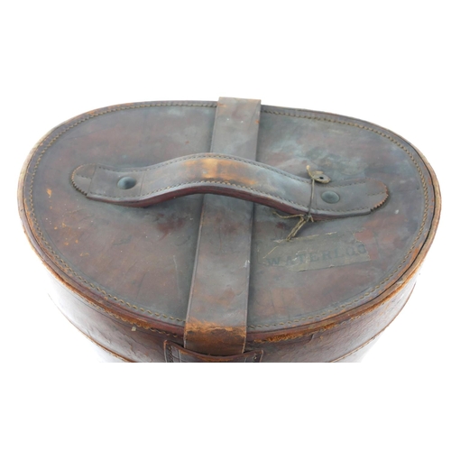 491a - AN EARLY 20TH CENTURY BEAVER SKIN TOP HAT AND LEATHER HAT BOX
Hat marked ‘Albert Thrussell, Birmingh... 