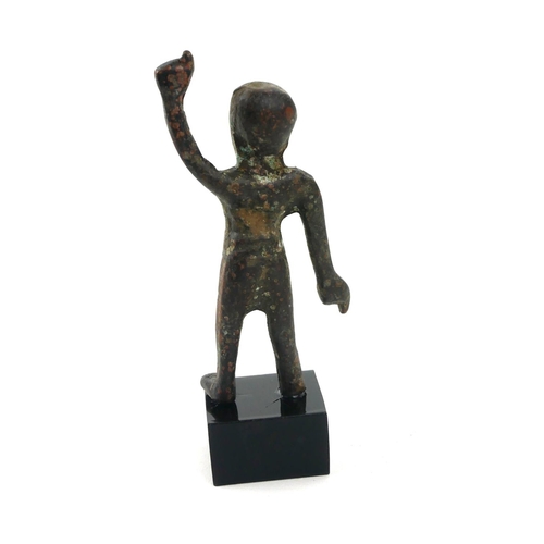 497 - A CHINESE BRONZE WARRIOR FIGURE
Standing pose with one arm raised, on black perspex base. 
(figure a... 