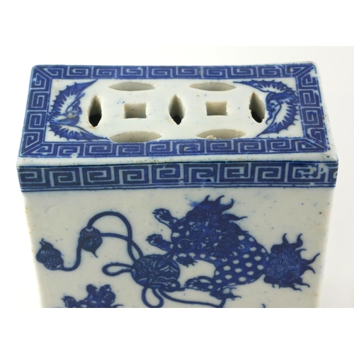 517 - A CHINESE BLUE AND WHITE PORCELAIN FLOWER BRICK
Decorated with Kylins at play. 
(approx 13cm x 15cm)