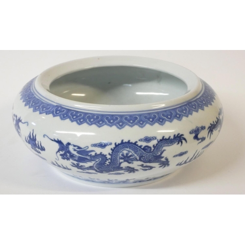 520 - A CHINESE BLUE AND WHITE PORCELAIN DRAGON BOWL
Decorated with opposing dragons chasing a flaming pea... 