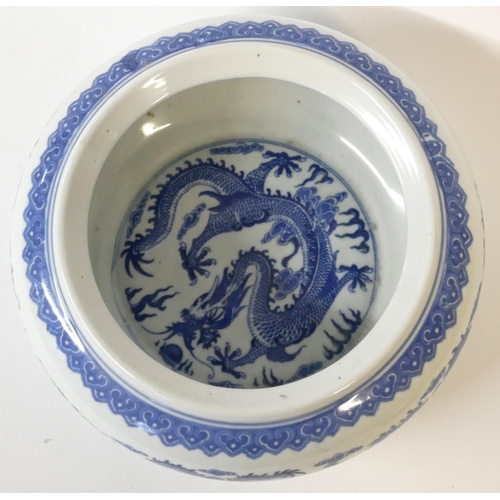 520 - A CHINESE BLUE AND WHITE PORCELAIN DRAGON BOWL
Decorated with opposing dragons chasing a flaming pea... 