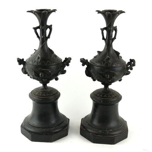 536 - A PAIR OF 19TH CENTURY CONTINENTAL  BRONZE AND MARBLE CANDLESTICKS
Organic sectional form, on an oct... 