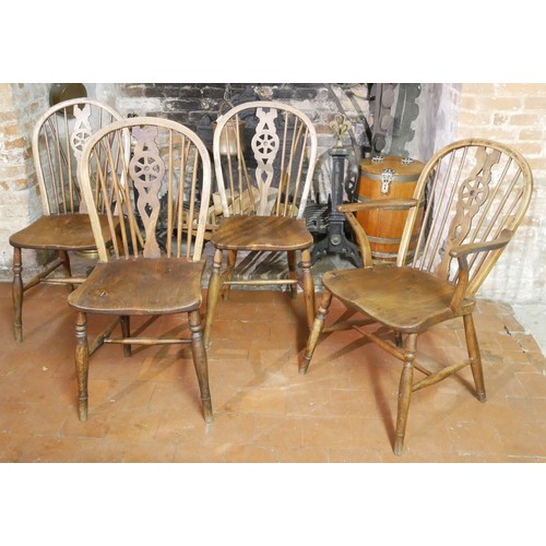 834 - A SET OF FOUR 19TH CENTURY ASH AND ELM WINDSOR CHAIRS
Including one carver.