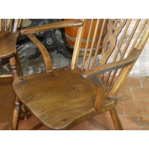 834 - A SET OF FOUR 19TH CENTURY ASH AND ELM WINDSOR CHAIRS
Including one carver.