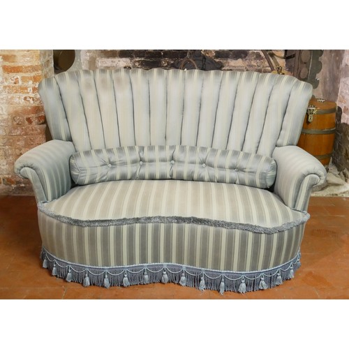 832 - AN ART DECO DESIGN KIDNEY FORM TWO SEATER WINDOW SETTEE
With shell back, in pale green fabric uphols... 