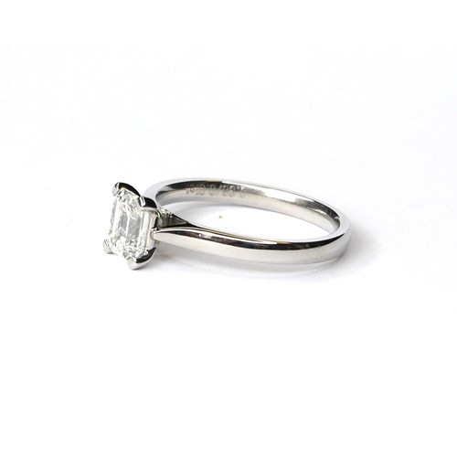 242a - AN 18CT WHITE GOLD AND DIAMOND SOLITAIRE RING
The emerald cut stone on a plain gold shank, complete ... 