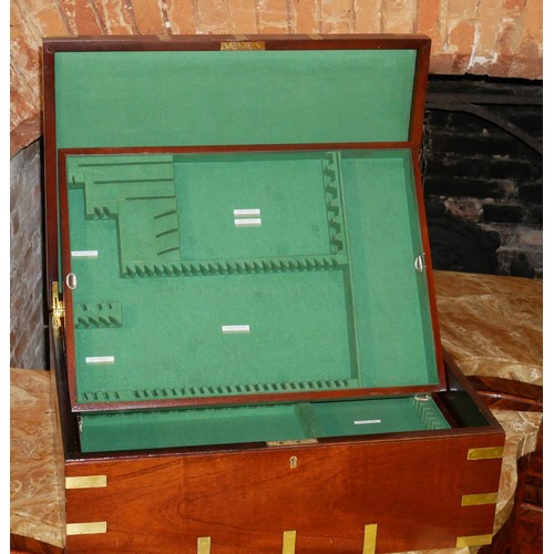 844 - A MAHOGANY AND BRASS BOUND MILITARY CUTLERY CASE
With fitted interior.
(56cm x 41cm x 21cm)