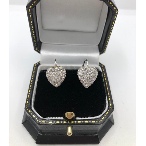 314A - A PAIR OF 18CT WHITE GOLD HEART SHAPED EARRINGS
encrusted with pave set diamonds
.8cm